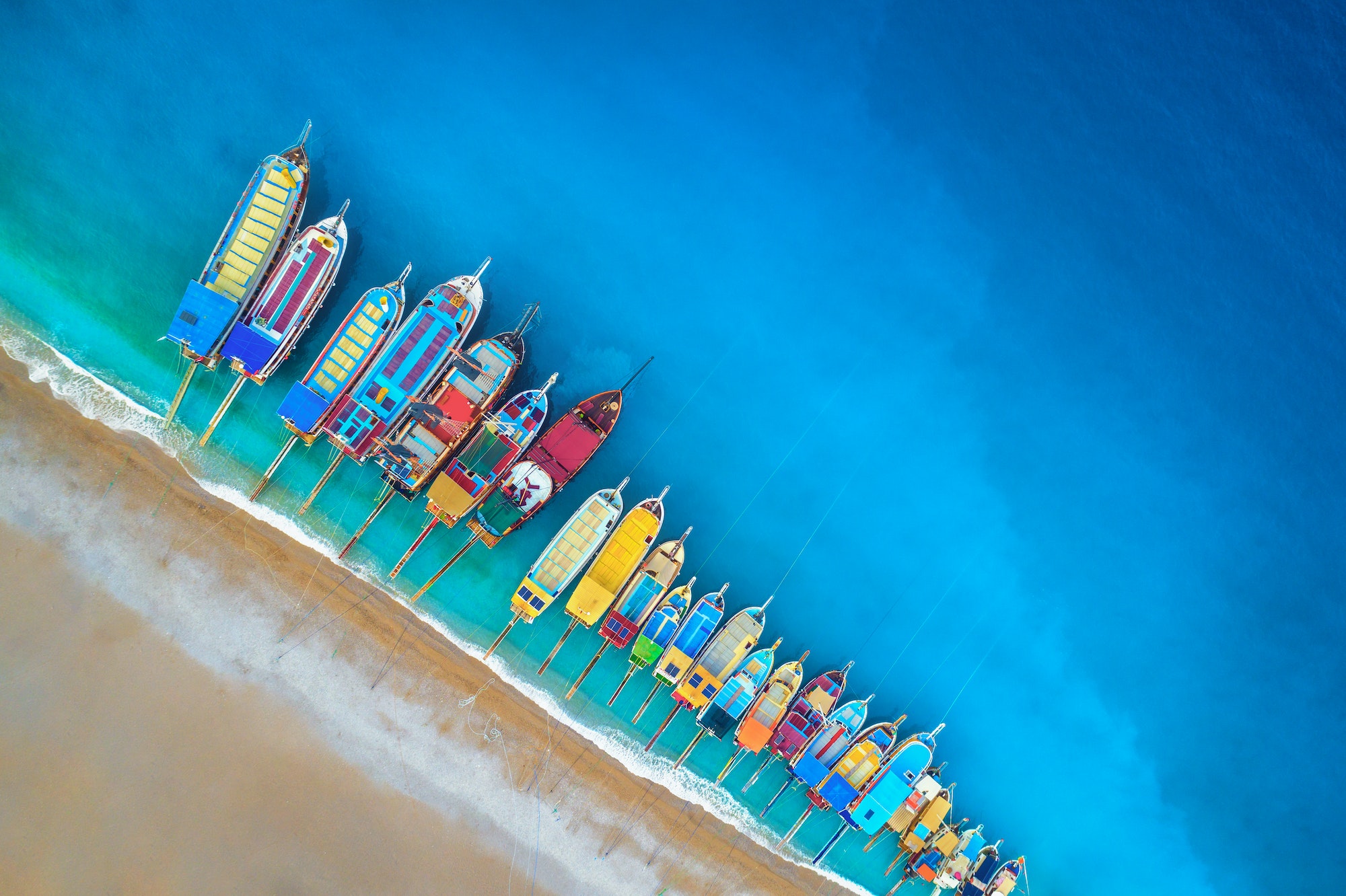 Aerial view of colorful boats in mediterranean sea